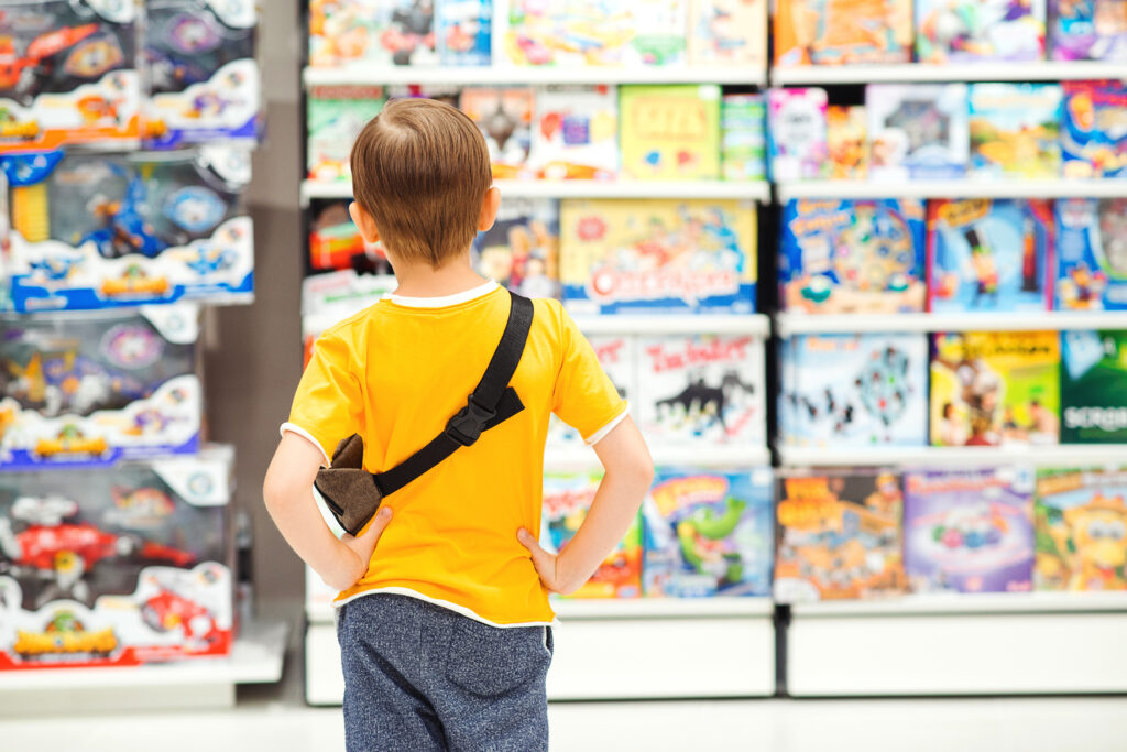 Child picking out a toy 

