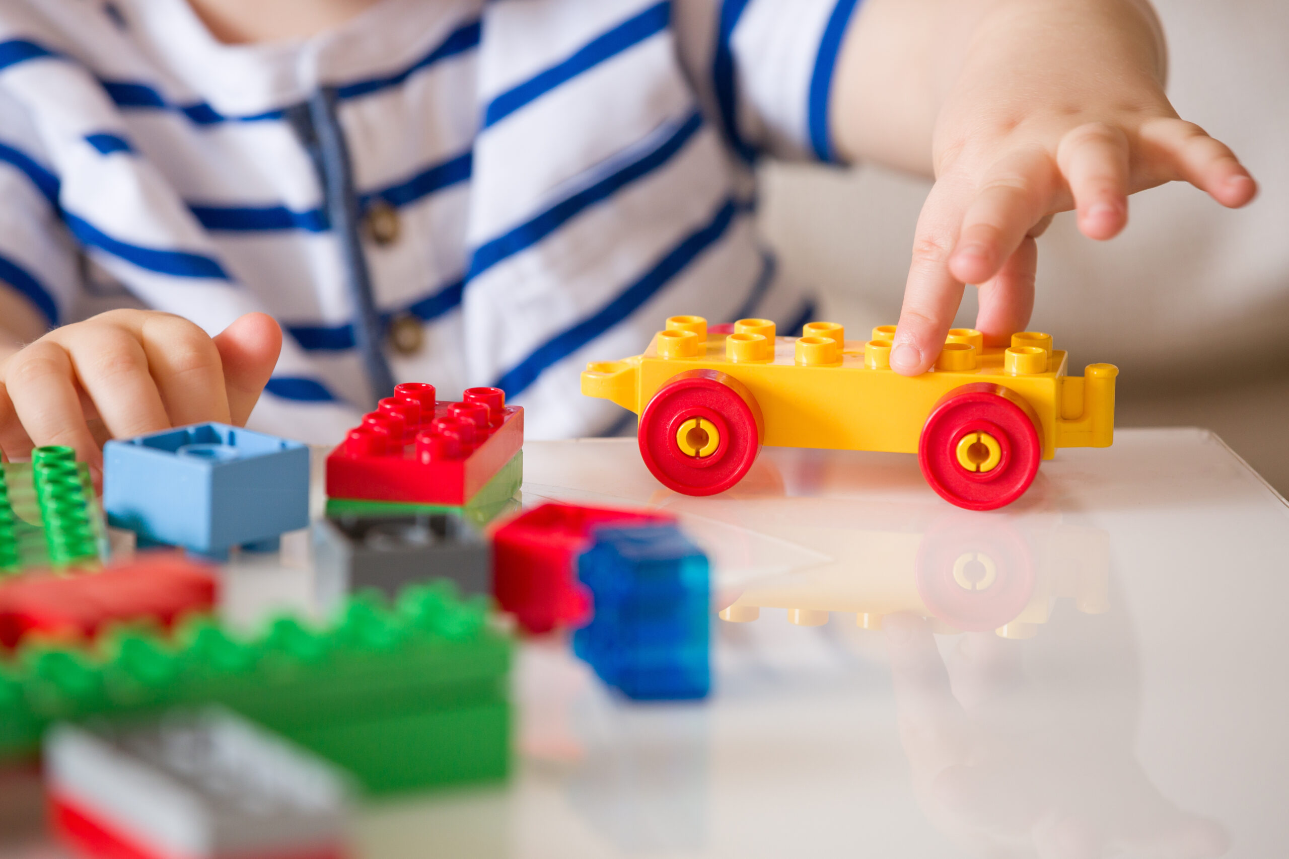 Toddler Playing with Lego Toys