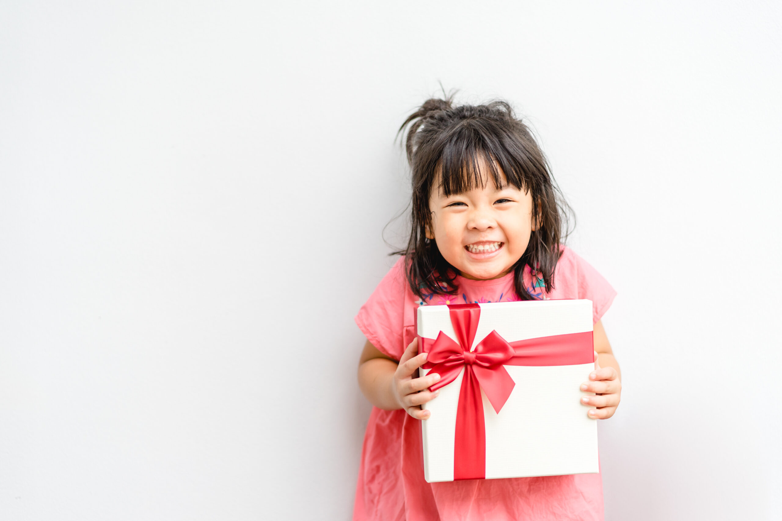 Little Girl holding a gift