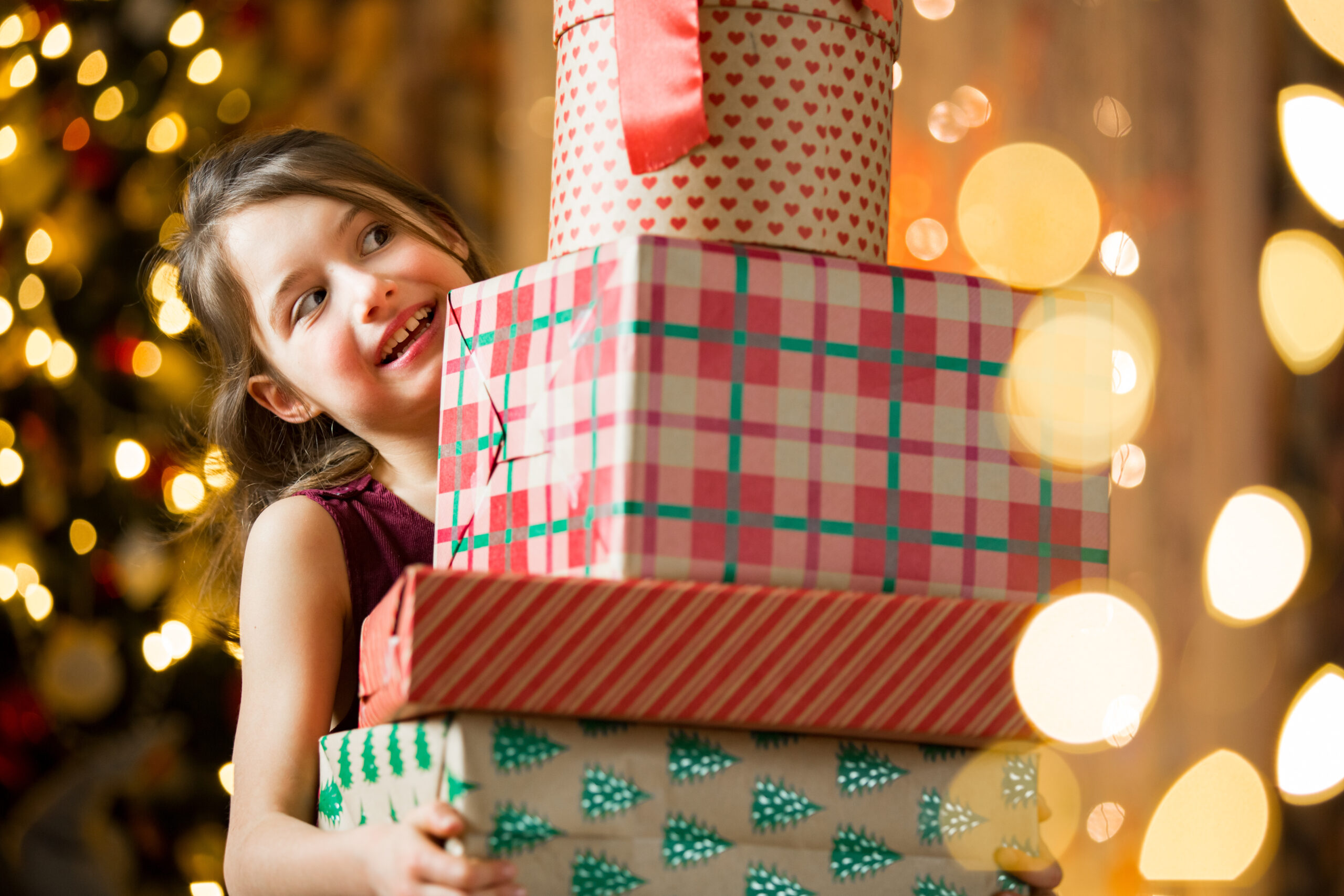 Child with lots of gifts on Christmas