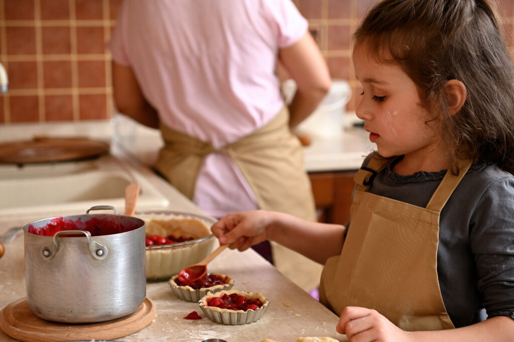 Girl helping with food at Thanksgiving