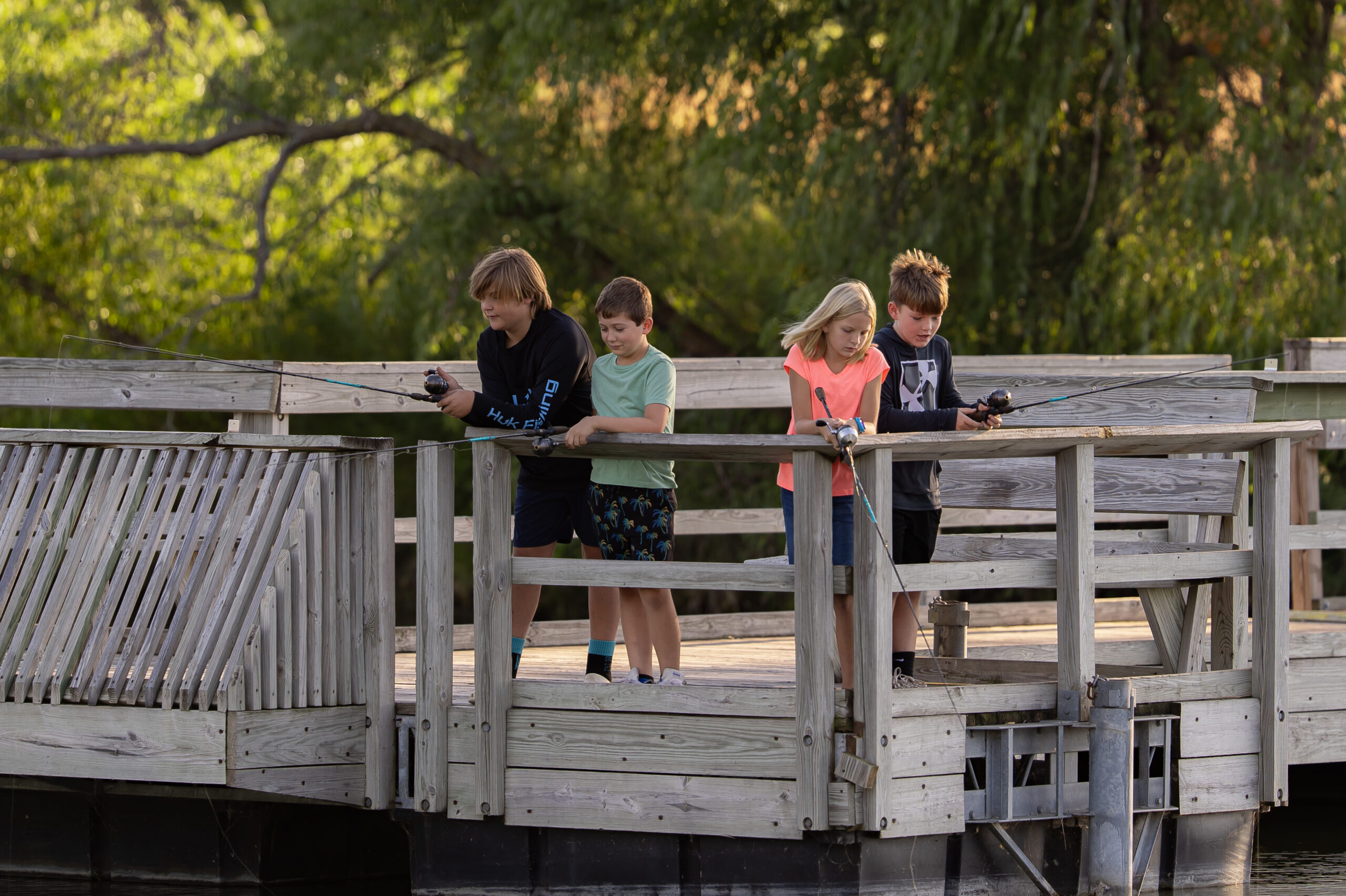 Kids Fishing at the Outdoor Campus off the Dock