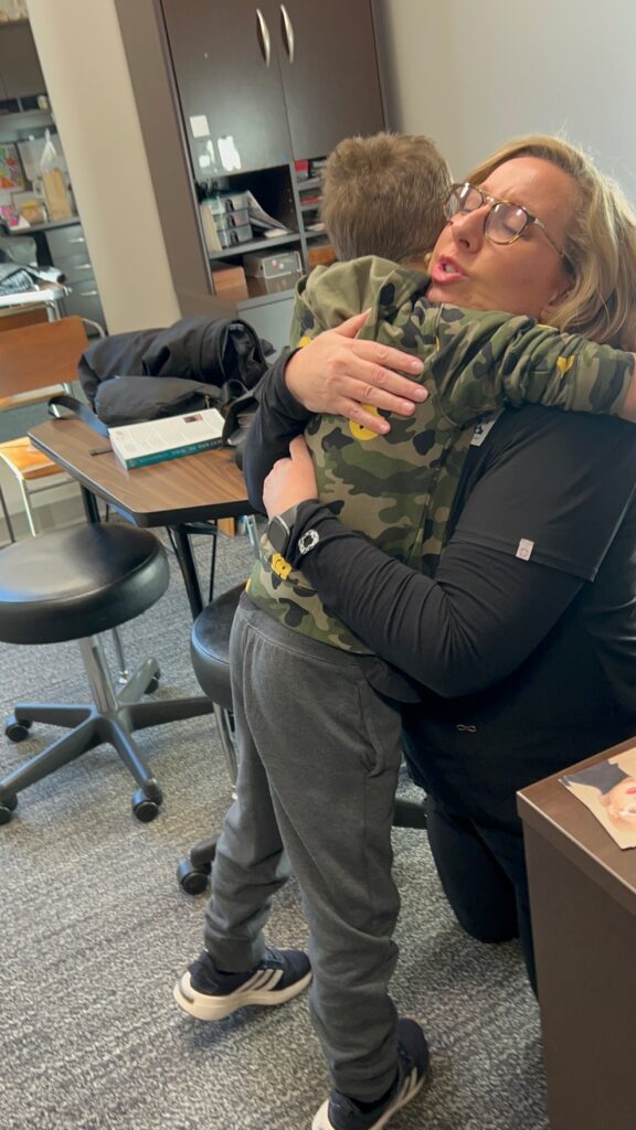 Visions Eye Care Therapy with Brenda and Hendrix Hugging